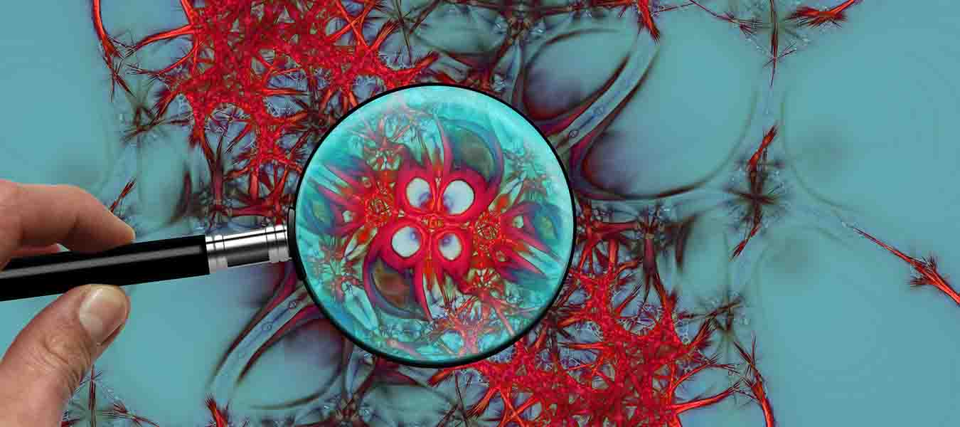 Magnifier over red matter over a blue surface