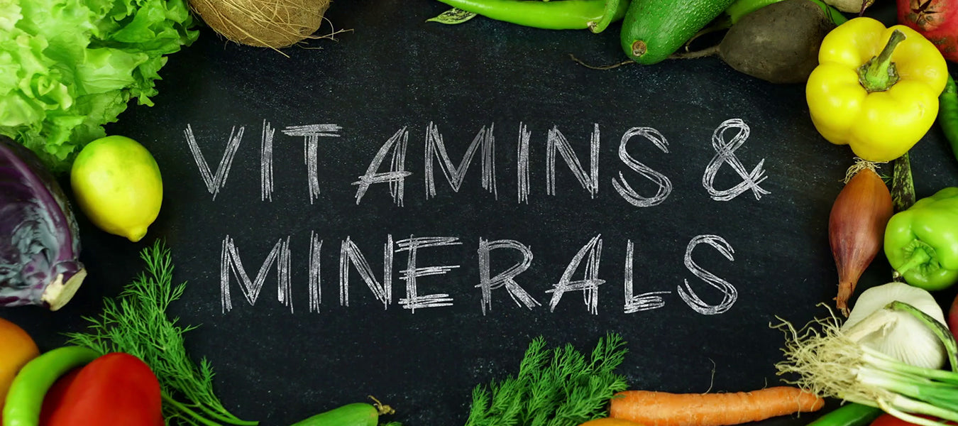 Clark board surrounded by greens reading Vitamins and Minerals