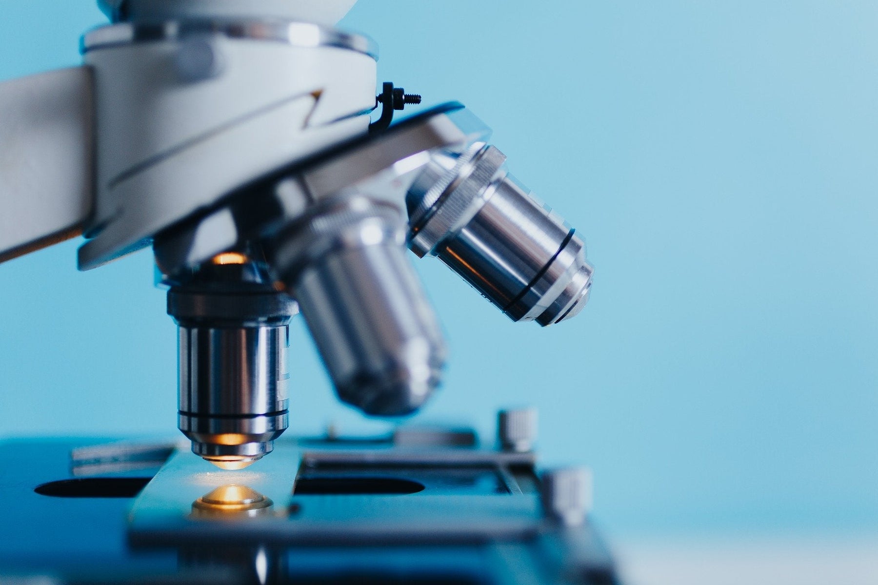 A microscope on a blue background