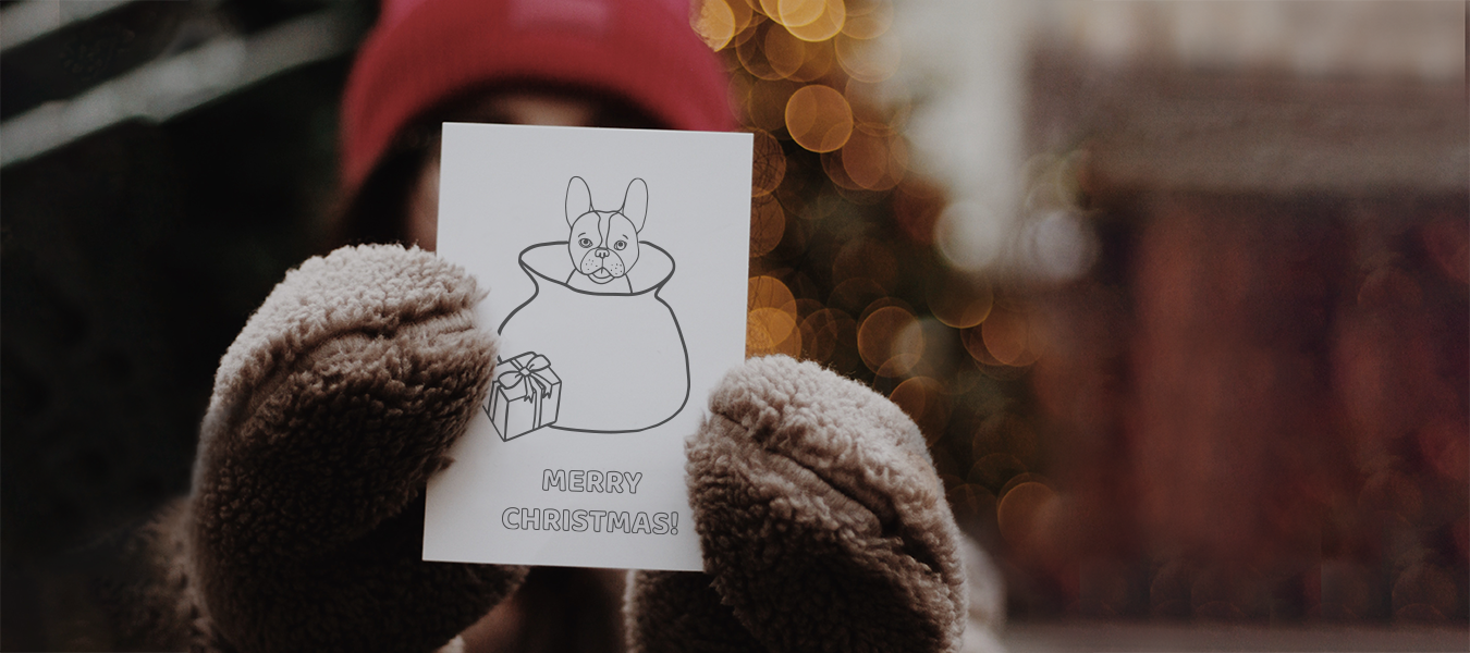 Woman with gloves holding a card with drawings