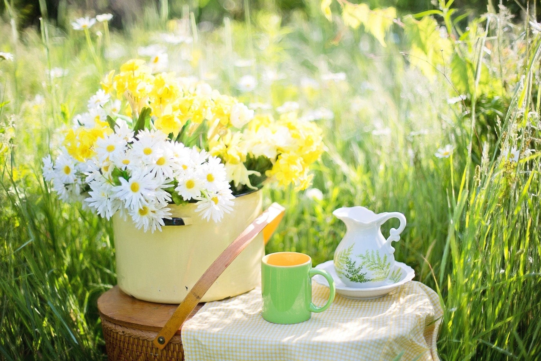 Tea outside in nature surrounded by flowers