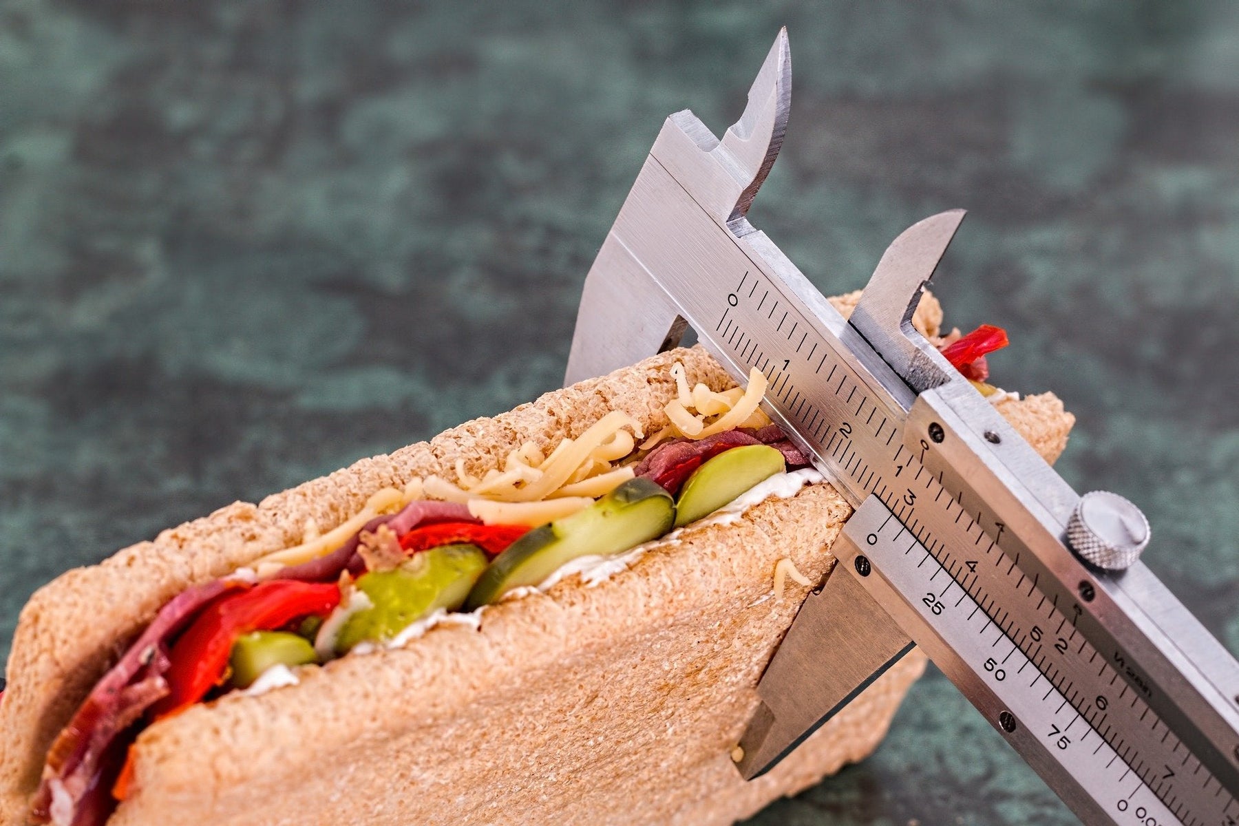 Sandwich being measured with a fat percentage device
