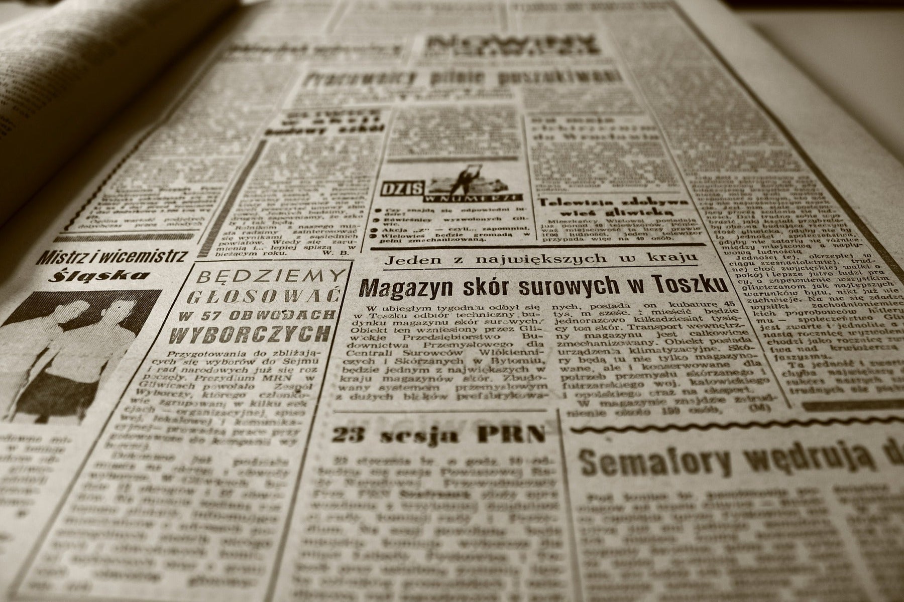 Large old newspaper laying on a table
