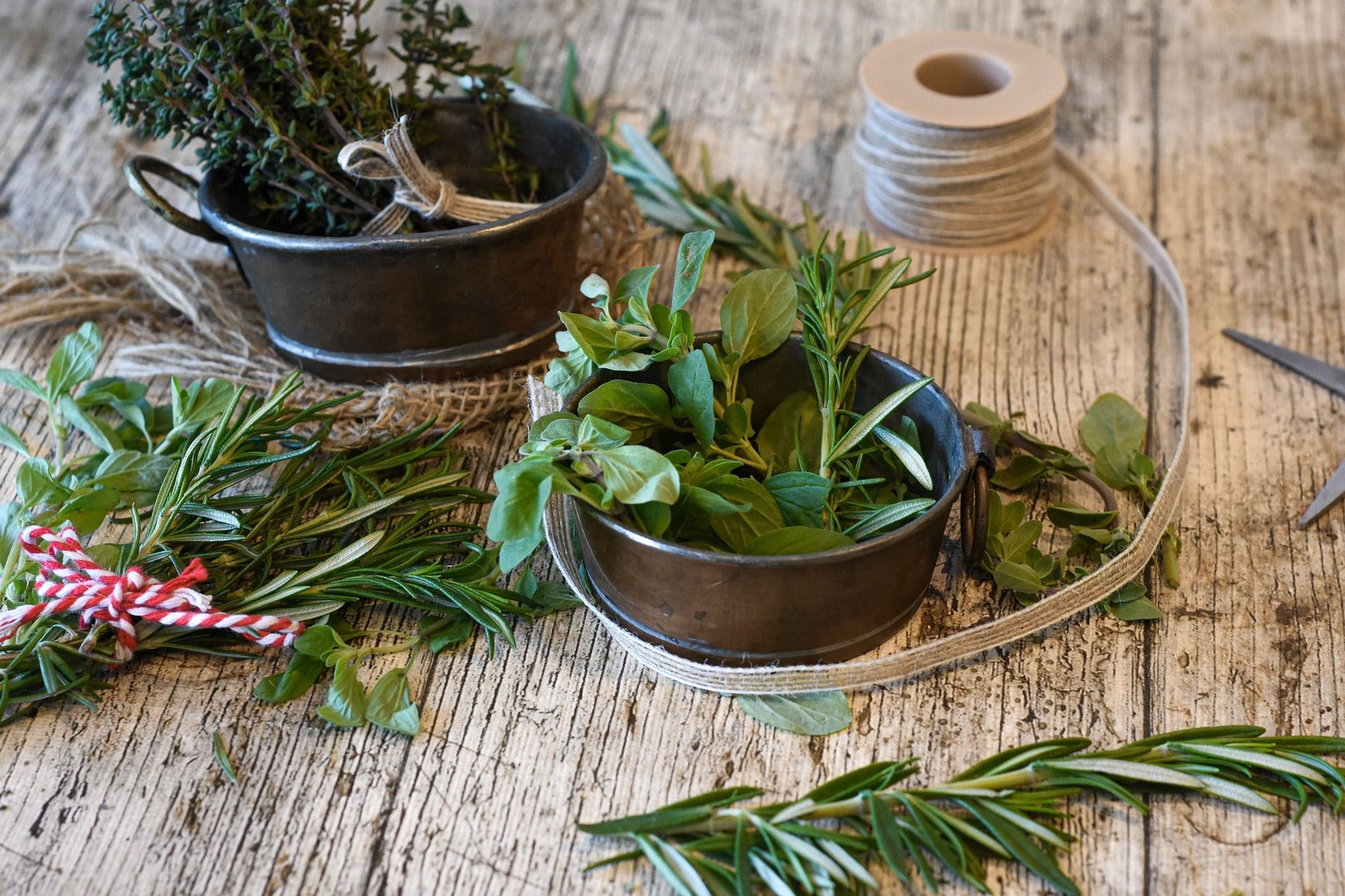 Spices in different recipients over a wooden floor