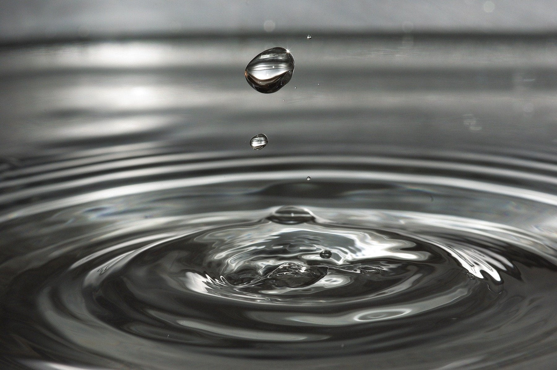 Splash creating a drop of water in the air