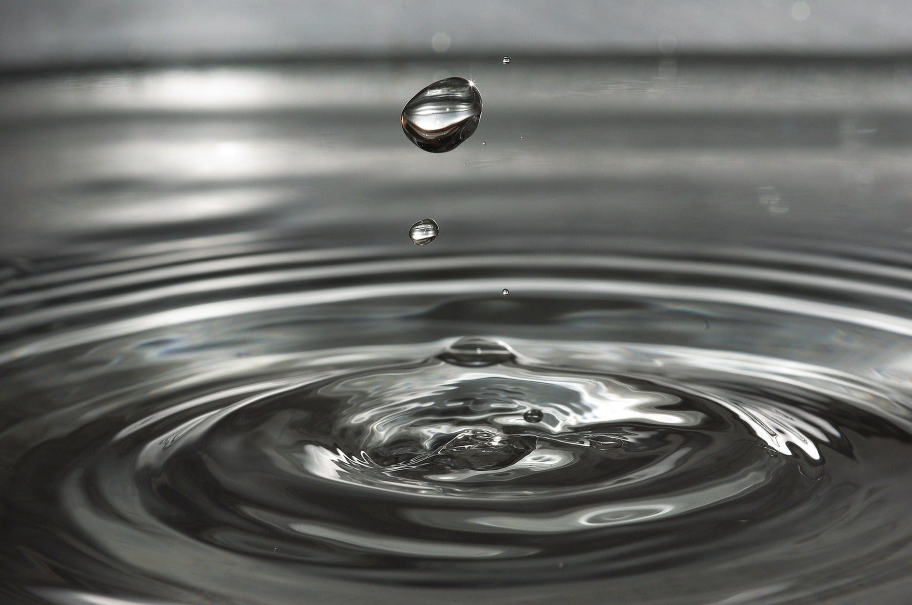 Drop of water creating waves around it