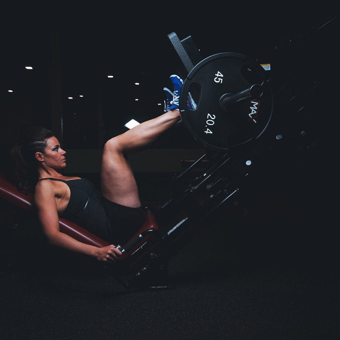 Woman at the gym working out legs