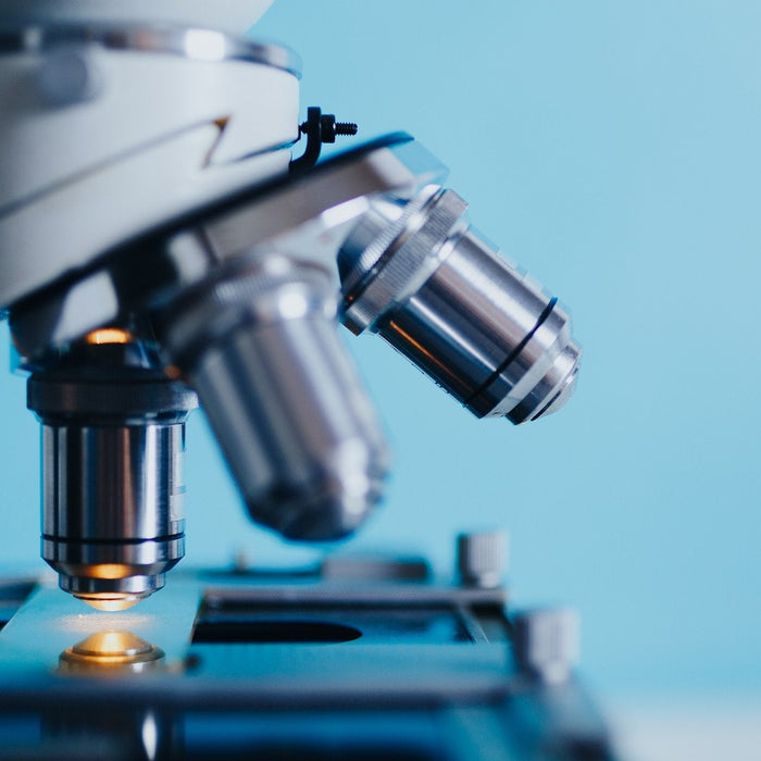A microscope on a blue background