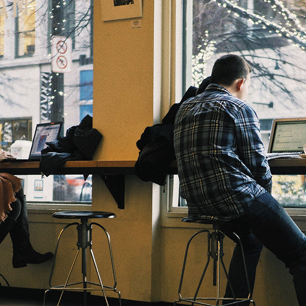 People working remotely from a coffee shop
