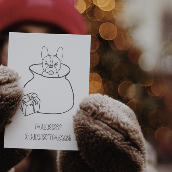Woman with gloves holding a card with drawings