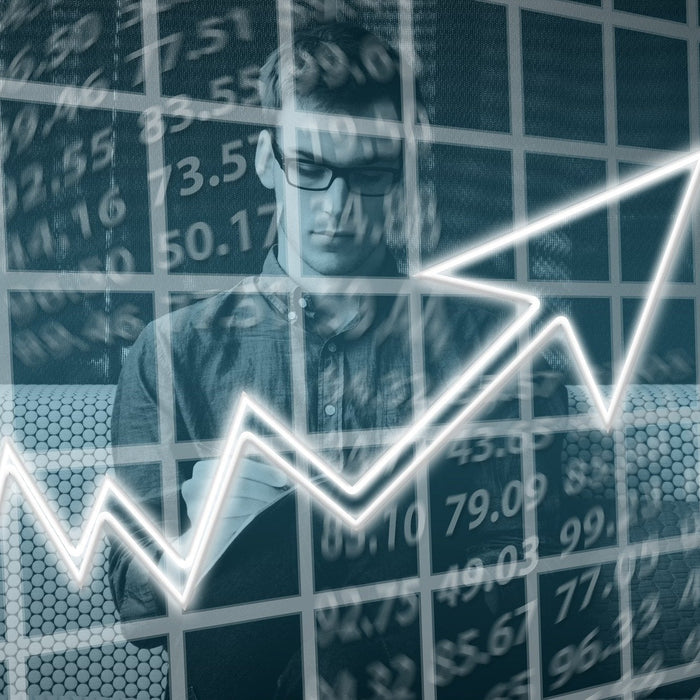 Man thinking covered by a graph pointing up