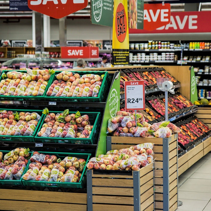 Grocery store showing baskets full of vegetables