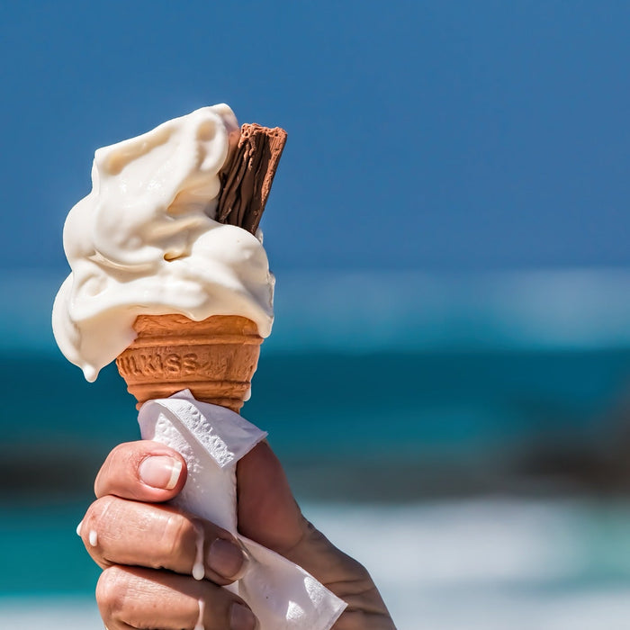 Eating ice cream with a piece of chocolate next to the beach