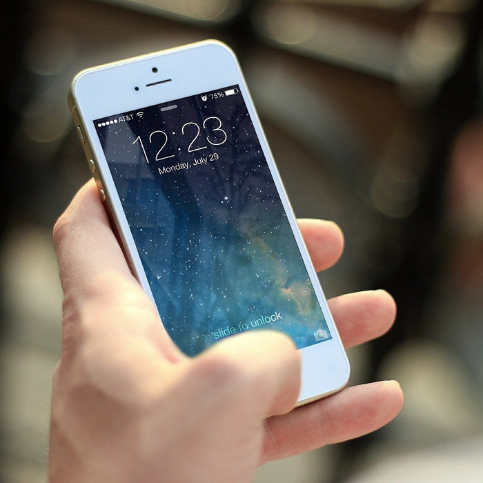 Man holding a white phone