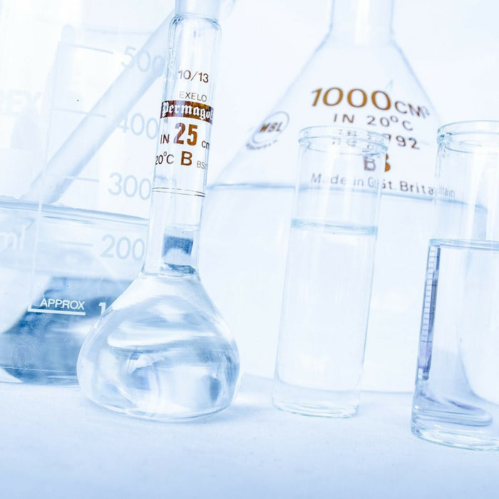 Laboratory glass recipients on a table