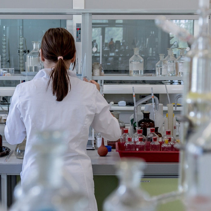 Woman in white working in a laboratory