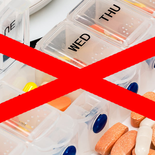 Big red cross over image of pills sectioned for each week day
