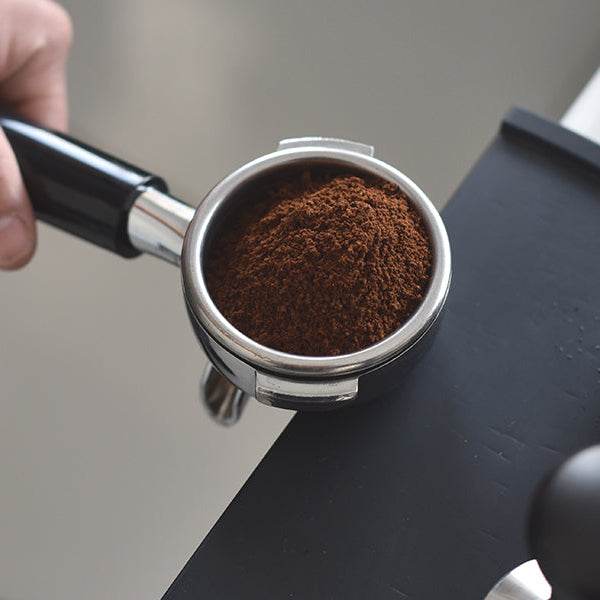 Man holding device for making coffee