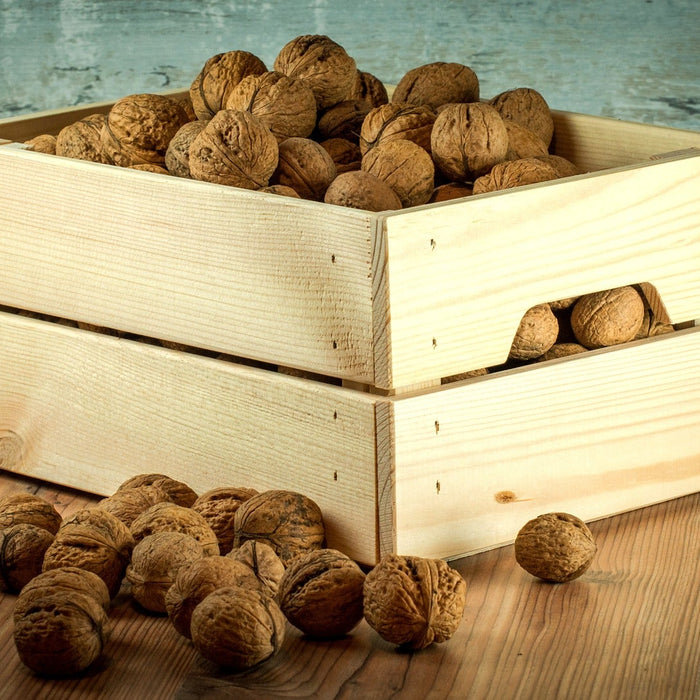 Nuts in a wood container over the floor