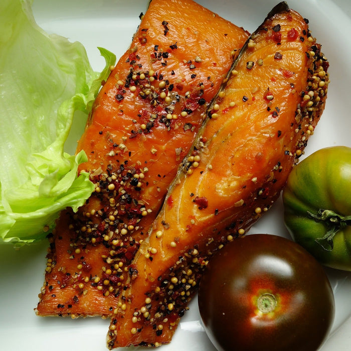 Salmon with salad and tomatoes on a plate