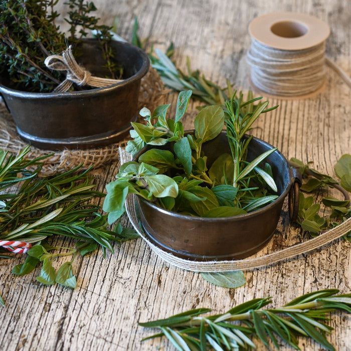 Spices in different recipients over a wooden floor