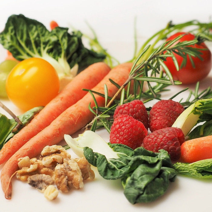 Fruits and vegetables laying on a table